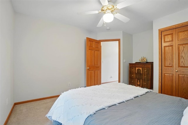 4317 Indian Tl NE, Solon, IA 52333 - bedroom featuring light carpet, a closet, and a ceiling fan