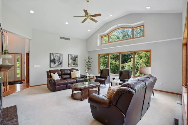 4317 Indian Tl NE, Solon, IA 52333 - living area featuring light carpet, a ceiling fan, high vaulted ceiling, and recessed lighting