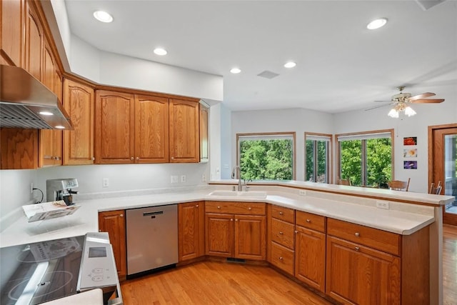 4317 Indian Tl NE, Solon, IA 52333 - kitchen featuring dishwasher, stove, a peninsula, light wood-style floors, and brown cabinets
