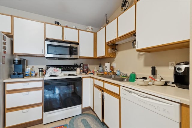 1230 Murray NE Unit 10, Cedar Rapids, IA 52402 - kitchen featuring stainless steel microwave, range with electric cooktop, dishwasher, light countertops, and white cabinetry