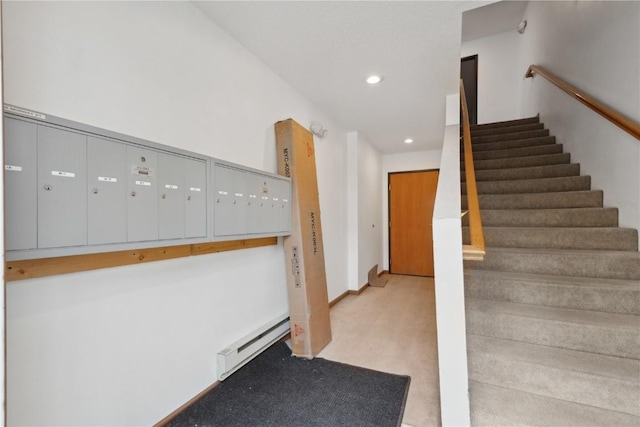 1230 Murray NE Unit 10, Cedar Rapids, IA 52402 - stairway featuring a baseboard radiator, mail area, carpet floors, and recessed lighting