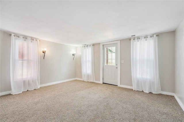 316 E Washington St, Center Point, IA 52213 - unfurnished room with carpet flooring