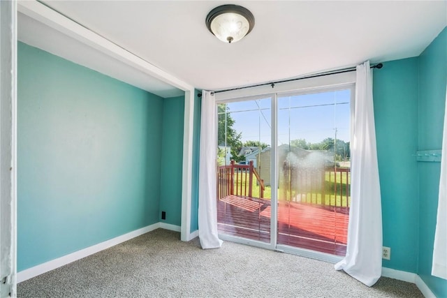 316 E Washington St, Center Point, IA 52213 - doorway with carpet flooring and baseboards