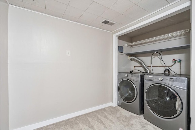 316 E Washington St, Center Point, IA 52213 - laundry area with light carpet and separate washer and dryer
