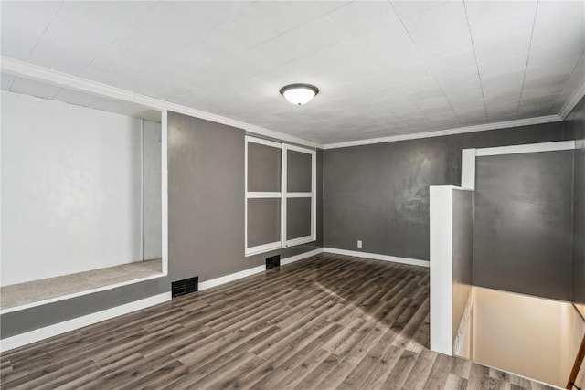316 E Washington St, Center Point, IA 52213 - empty room featuring wood finished floors and crown molding
