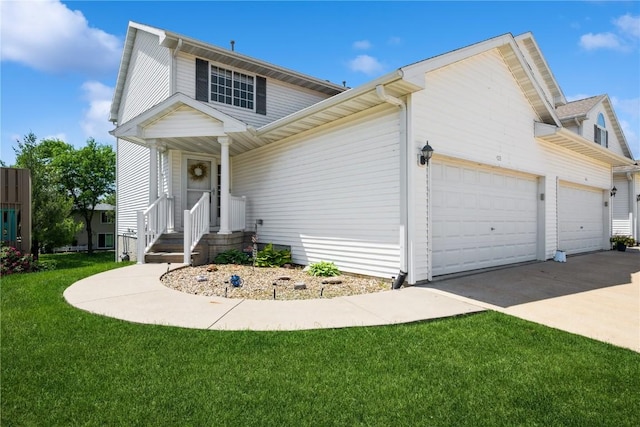 4593 Spoonbill Ct, Marion, IA 52302 - view of front of home with an attached garage, driveway, and a front lawn