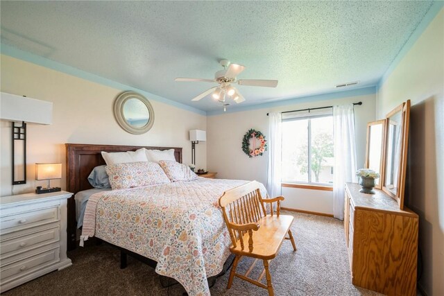 4593 Spoonbill Ct, Marion, IA 52302 - carpeted bedroom featuring a textured ceiling and ceiling fan