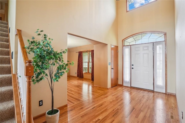 5515 W Mustang Rd NE, Cedar Rapids, IA 52411 - foyer with stairway, light wood finished floors, and a high ceiling