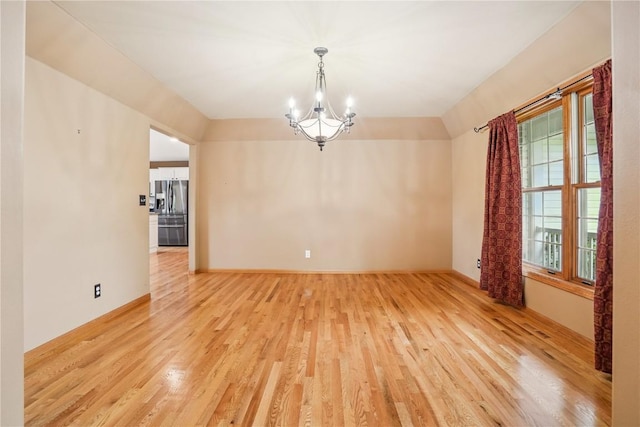 5515 W Mustang Rd NE, Cedar Rapids, IA 52411 - empty room featuring light wood-style flooring and a chandelier