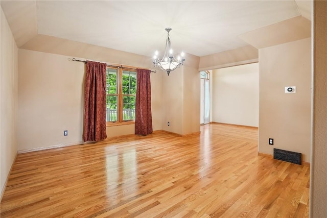 5515 W Mustang Rd NE, Cedar Rapids, IA 52411 - spare room featuring a chandelier and light wood finished floors