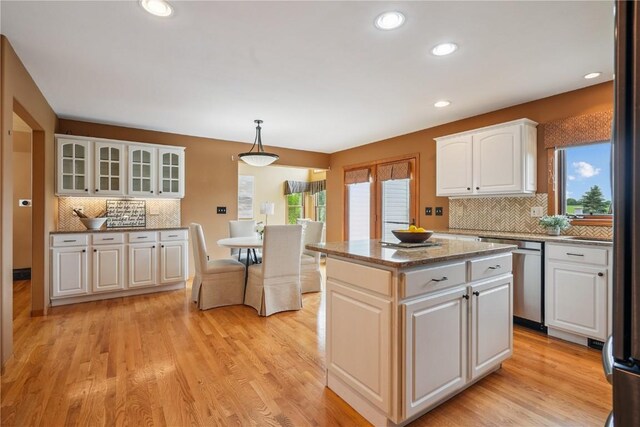 5515 W Mustang Rd NE, Cedar Rapids, IA 52411 - kitchen featuring stainless steel dishwasher, plenty of natural light, tasteful backsplash, a kitchen island, and recessed lighting