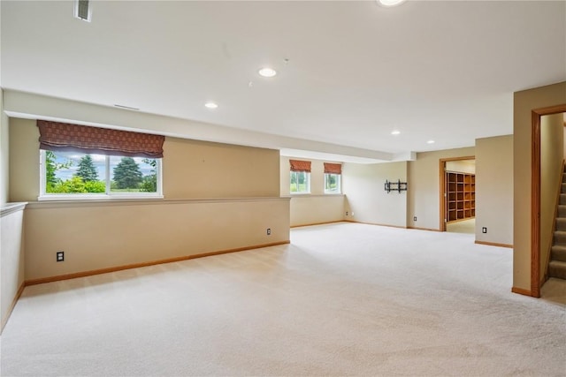 5515 W Mustang Rd NE, Cedar Rapids, IA 52411 - spare room with carpet floors, stairs, and recessed lighting