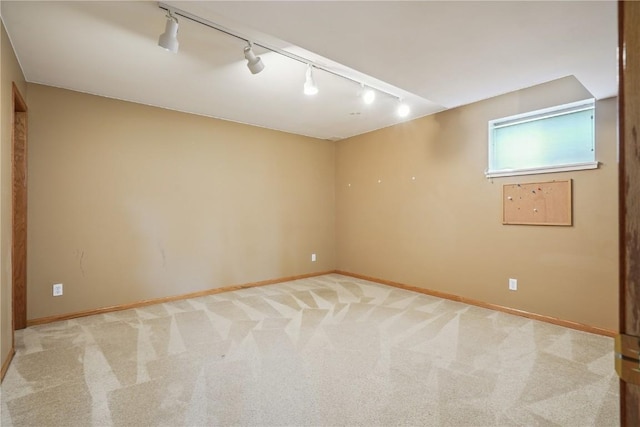 5515 W Mustang Rd NE, Cedar Rapids, IA 52411 - unfurnished room with rail lighting and light carpet