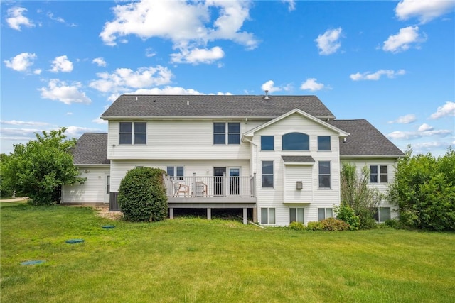 5515 W Mustang Rd NE, Cedar Rapids, IA 52411 - rear view of property with a lawn, a deck, and roof with shingles