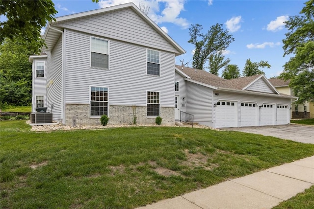 3921 Lexington Dr NE Unit B, Cedar Rapids, IA 52402 - view of front facade with an attached garage, driveway, brick siding, and a front yard