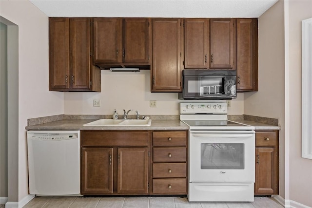 3921 Lexington Dr NE Unit B, Cedar Rapids, IA 52402 - kitchen with white appliances and light tile patterned flooring