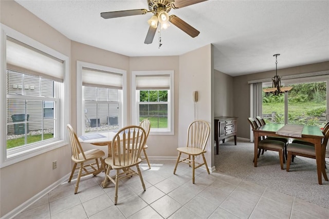 3921 Lexington Dr NE Unit B, Cedar Rapids, IA 52402 - dining area with plenty of natural light, light tile patterned floors, and a chandelier