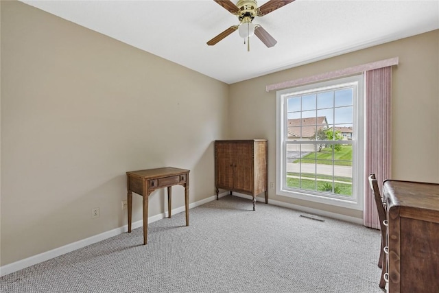 3921 Lexington Dr NE Unit B, Cedar Rapids, IA 52402 - living area with carpet floors and ceiling fan