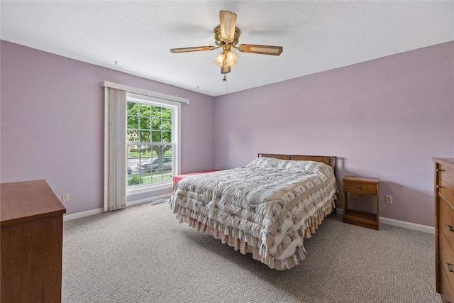 3921 Lexington Dr NE Unit B, Cedar Rapids, IA 52402 - carpeted bedroom with baseboards and ceiling fan