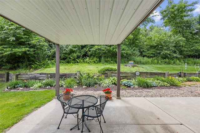 3921 Lexington Dr NE Unit B, Cedar Rapids, IA 52402 - view of patio / terrace featuring view of wooded area