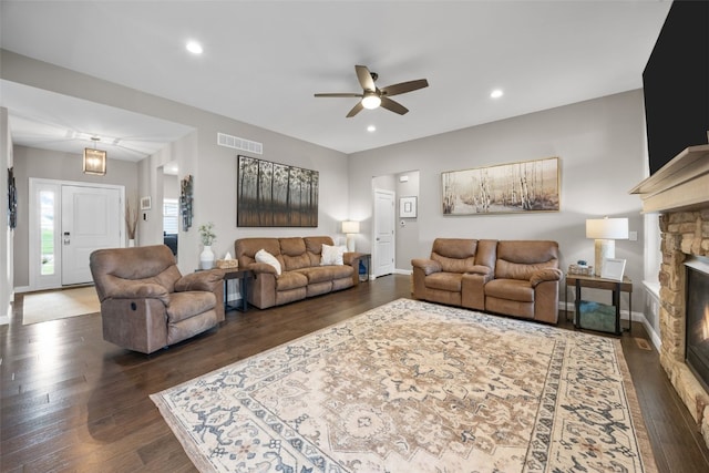 1953 Bowstring Dr, Marion, IA 52302 - living area featuring a ceiling fan, dark wood finished floors, a stone fireplace, and recessed lighting