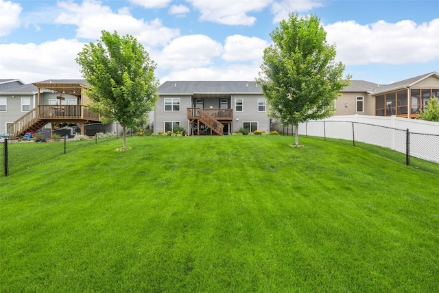 1953 Bowstring Dr, Marion, IA 52302 - fenced backyard featuring stairs, a wooden deck, a sunroom, and a residential view