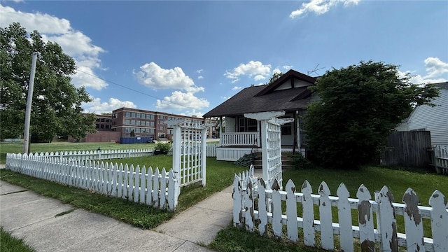419 21st St NE, Cedar Rapids, IA 52402 - view of front facade featuring a fenced front yard and roof with shingles