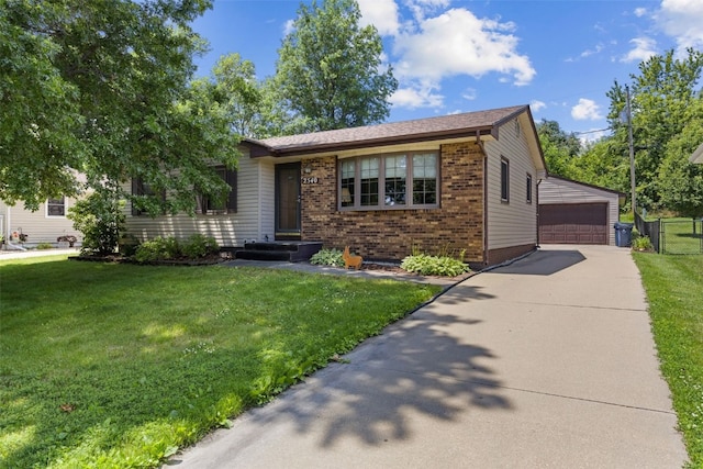 2540 Lori Dr SW, Cedar Rapids, IA 52404 - view of front facade featuring brick siding, a detached garage, and an outdoor structure