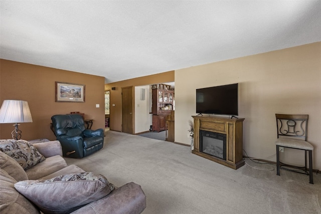 2540 Lori Dr SW, Cedar Rapids, IA 52404 - carpeted living area with a glass covered fireplace