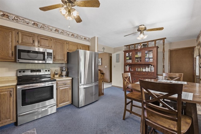 2540 Lori Dr SW, Cedar Rapids, IA 52404 - kitchen with appliances with stainless steel finishes, ceiling fan, and light countertops
