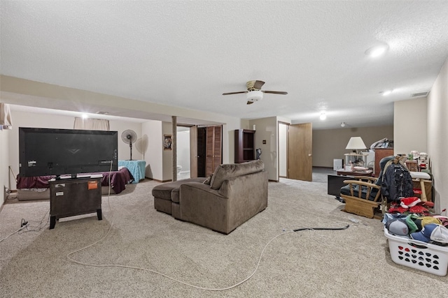 2540 Lori Dr SW, Cedar Rapids, IA 52404 - living room featuring carpet floors, a textured ceiling, and ceiling fan