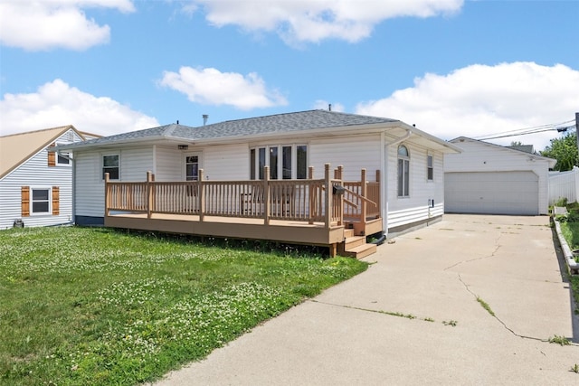 2469 1st St SW, Cedar Rapids, IA 52404 - back of house featuring a deck, a yard, a detached garage, and an outdoor structure