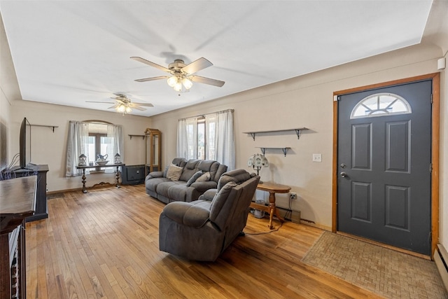 2469 1st St SW, Cedar Rapids, IA 52404 - living room featuring plenty of natural light, a ceiling fan, and light wood-style flooring