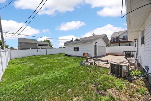 2469 1st St SW, Cedar Rapids, IA 52404 - fenced backyard featuring a garage and a patio area