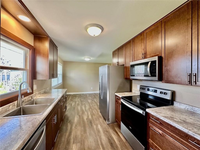 3025 4th Ave, Marion, IA 52302 - kitchen with stainless steel appliances, light wood-style floors, and light countertops