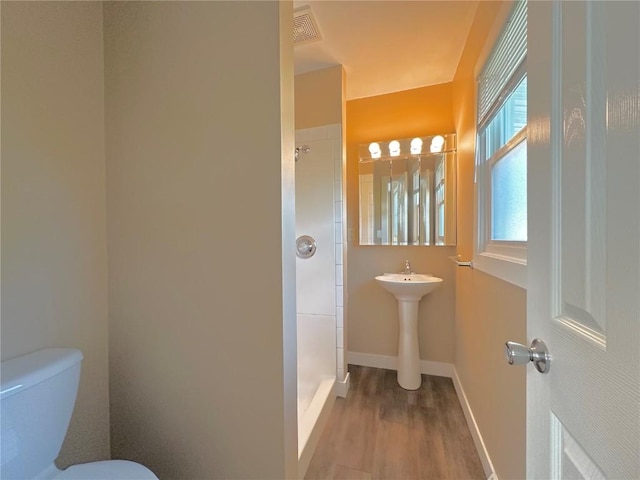 3025 4th Ave, Marion, IA 52302 - bathroom with a shower stall and wood finished floors