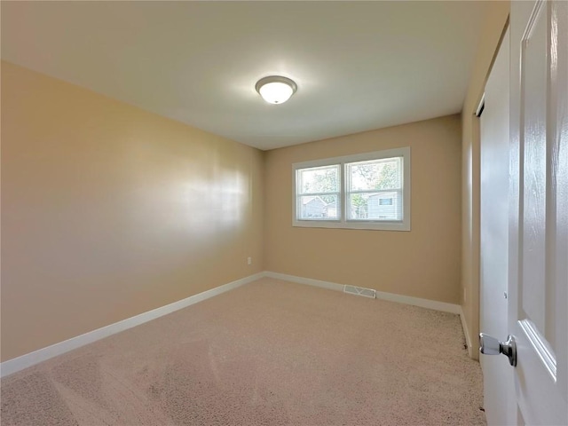 3025 4th Ave, Marion, IA 52302 - spare room featuring carpet and baseboards