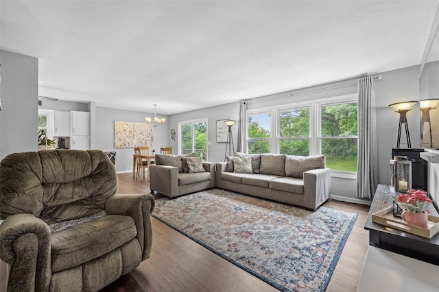 1428 Timber Ridge Trl NE, Solon, IA 52333 - living room featuring a chandelier and wood finished floors