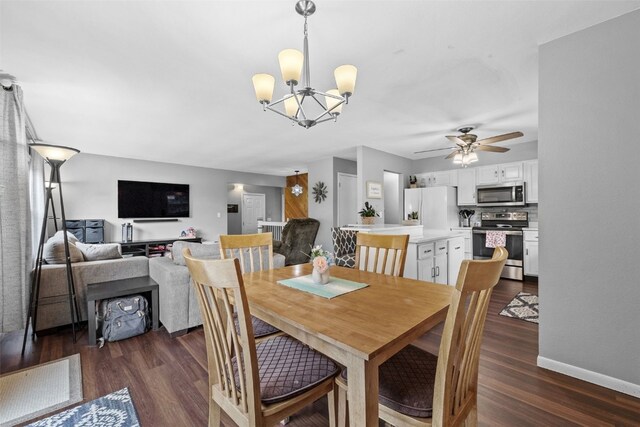 1428 Timber Ridge Trl NE, Solon, IA 52333 - dining space featuring a chandelier, dark wood finished floors, and ceiling fan