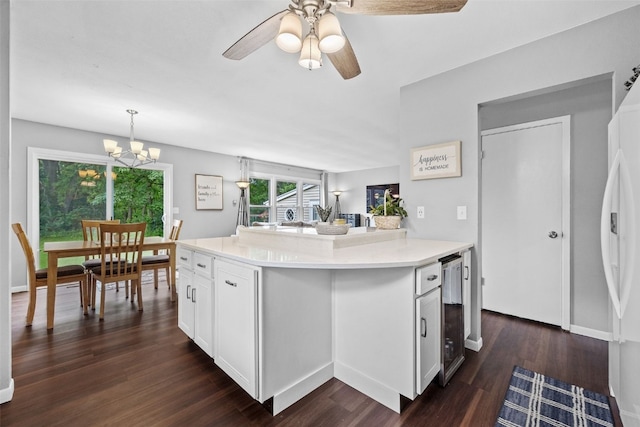 1428 Timber Ridge Trl NE, Solon, IA 52333 - kitchen with dark wood-style floors, white cabinetry, a chandelier, a ceiling fan, and light countertops