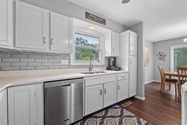 1428 Timber Ridge Trl NE, Solon, IA 52333 - kitchen with stainless steel dishwasher, backsplash, dark wood finished floors, white cabinetry, and light countertops