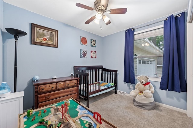 1428 Timber Ridge Trl NE, Solon, IA 52333 - carpeted bedroom featuring a crib and ceiling fan