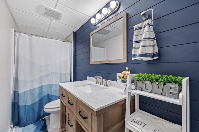 1428 Timber Ridge Trl NE, Solon, IA 52333 - bathroom with vanity, wood walls, and a shower with shower curtain