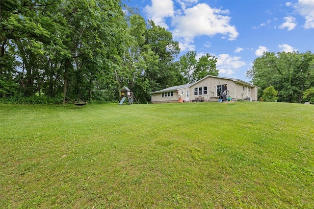 1428 Timber Ridge Trl NE, Solon, IA 52333 - view of green lawn featuring a playground