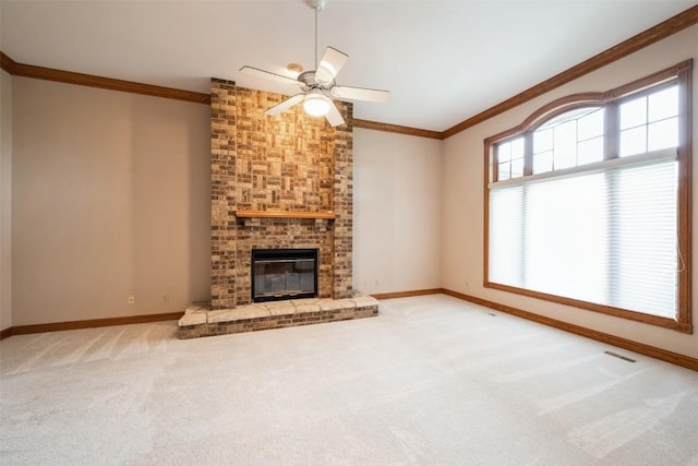 3519 Timber Ridge Trl NE, Cedar Rapids, IA 52411 - unfurnished living room featuring ornamental molding, carpet floors, a ceiling fan, and a fireplace