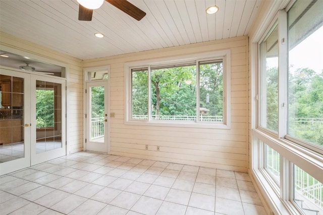 3519 Timber Ridge Trl NE, Cedar Rapids, IA 52411 - unfurnished sunroom featuring french doors, healthy amount of natural light, wooden walls, recessed lighting, and tile patterned floors
