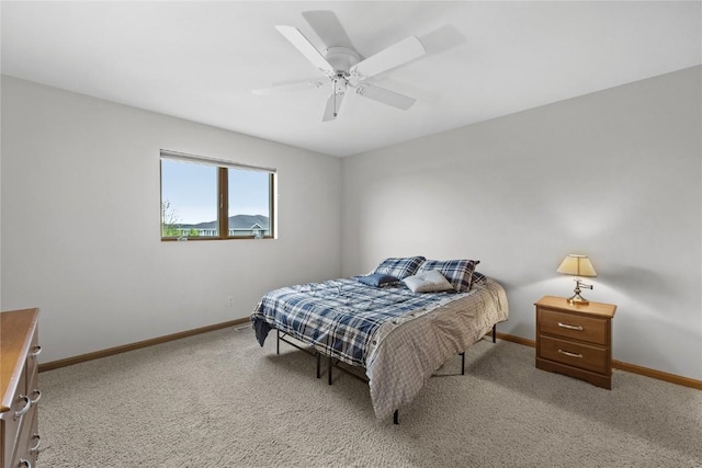 664 J Ave NE Unit A, Cedar Rapids, IA 52402 - bedroom featuring light colored carpet and a ceiling fan