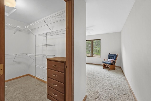 664 J Ave NE Unit A, Cedar Rapids, IA 52402 - spacious closet featuring carpet flooring and a ceiling fan