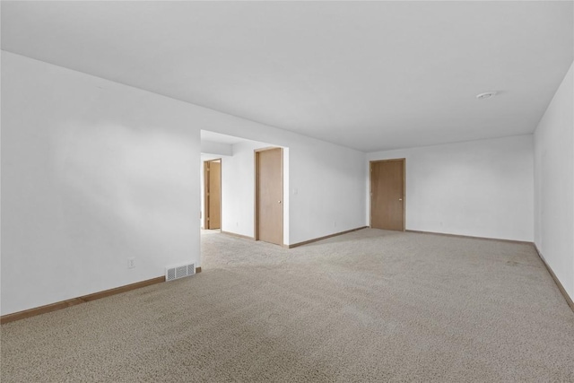 664 J Ave NE Unit A, Cedar Rapids, IA 52402 - unfurnished room featuring light carpet and baseboards
