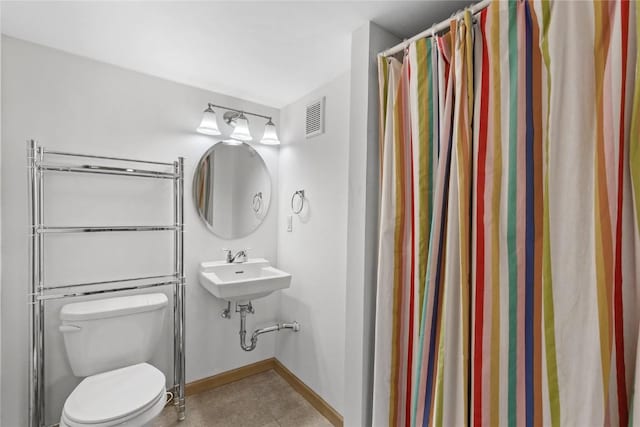 664 J Ave NE Unit A, Cedar Rapids, IA 52402 - bathroom with tile patterned floors and a shower with curtain